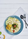 Peruvian food: fish ceviche de giant squid, served on a blue plate, Top view Royalty Free Stock Photo