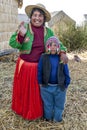 A Peruvian lady and her son at Uros on Lake Titicaca in Peru.