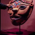 Peruvian Mayan Mask on stand in studio. Multi color. Studio Backdrop.