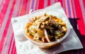 Peruvian mixed ceviche with red onion and fried corn at a street food market Royalty Free Stock Photo