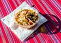 Peruvian mixed ceviche with red onion and fried corn at a street food market Royalty Free Stock Photo