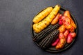 Peruvian raw ingredients for cooking black corn and sweet potatoes. Top view Royalty Free Stock Photo