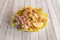 Peruvian recipe Jalea of seafood and vegetables battered and fried with red onion with various types Royalty Free Stock Photo