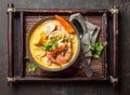 Peruvian seafood soup Chupe de Camarones in gray bowl, top view