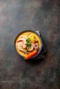 Peruvian seafood soup Chupe de Camarones in gray bowl, top view Royalty Free Stock Photo