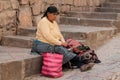 Peruvian street market, old woman selling souvenirs Royalty Free Stock Photo