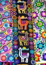 Peruvian traditional colourful native handicraft textile fabric with llama pattern at market in Peru, South Americain. Close up.