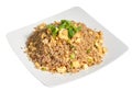 Peruvian traditional food. Rice with meat and vegetable, scramble eggs decorated with onian feather. Arroz chaufa