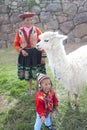 Peruvian Woman and Child with Alpaca