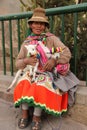 A Peruvian woman and her goats