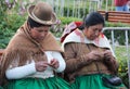 Peruvian woman knitting in a park