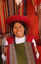 Peruvian woman selling colorful fabrics