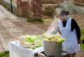 Peruvian woman selling corn