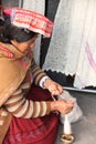 A Peruvian woman spinning wool