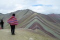 Peruvian woman watching montana De Siete Colores near Cuzco Royalty Free Stock Photo