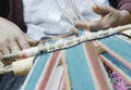 Peruvian woman weaving cloth on a hand loom Royalty Free Stock Photo