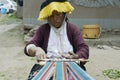 Peruvian woman weaving cloth on a hand loom Royalty Free Stock Photo