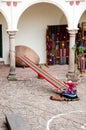 Peruvian woman weaving traditional fabrics, Cusco, Peru