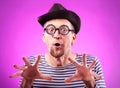 Pervert nerd in hat touches imaginary boobs Royalty Free Stock Photo