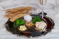 Pesah celebration Passover holiday. Traditional pesah plate text in hebrew: Passover, egg, Royalty Free Stock Photo