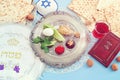 Pesah celebration concept (jewish Passove holiday). Traditional text in hebrew: Passover, horseradish, sweet dates jam