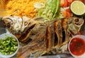 Pescado Frito, Mexican dish with fried tilapia, yellow rice and salad