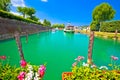 Peschiera del Garda turquoise river Mincio mouth in lake view