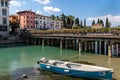 Peschiera del Garda, Verona, Italy - 22 September 2022 Beautiful cityscape with houses and boats at Canale di mezzo at