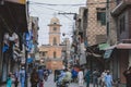 Daily life of the crowded Pakistan city center with the Buildings and Rickshaws