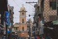 Daily life of the crowded Pakistan city center with the Buildings and Rickshaws