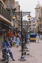 Daily life of the crowded Pakistan city center with the Buildings and Rickshaws