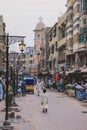 Daily life of the crowded Pakistan city center with the Buildings and Rickshaws