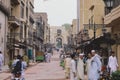 Daily life of the crowded Pakistan city center with the Buildings and Rickshaws