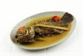 Pesmol Fish Tilapia or Ikan Nila, Yellow Curry Fish often Found in West Java, Indonesia