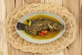 Pesmol Ika Nila, Tilapia Yellow Curry, Popular Curry Recipe made from Fried Fish in West Java, Indonesia