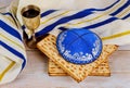 Matzo for Passover with kiddush cup of wine in the kippa