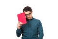 Pessimistic student guy looking down upset, as holds a book isolated on white background. Confused young man has learning troubles