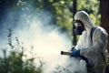 Pest control technician in protective suit effectively spraying toxic gas to eliminate pests