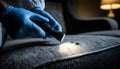 Pest control worker examines a home sofa for cockroaches and other pests using a flashlight. This inspection aims for Royalty Free Stock Photo