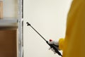 Pest control worker spraying pesticide, closeup Royalty Free Stock Photo