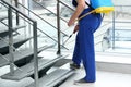 Pest control worker spraying pesticide near stairs, closeup Royalty Free Stock Photo