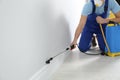 Pest control worker spraying pesticide. Space for text Royalty Free Stock Photo