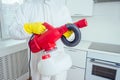 Pest control worker standing with sprayer in kitchen Royalty Free Stock Photo