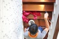 Pest termites control services on wood stair in the new house that have termites signs inside it Royalty Free Stock Photo