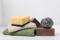 Pesticide-free cleaning concept.Closeup of towel, sponge, natural soap, scrubbers on the white surface