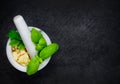 Pestle and Mortar with Basil and Cheese on Copy Space Royalty Free Stock Photo