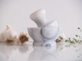 Pestle and Mortar with garlic and thyme herb Royalty Free Stock Photo