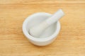 Pestle and mortar on wood Royalty Free Stock Photo