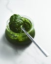 Pesto genovese or Pesto Verde. Italian sauce dip for pasta or other dishes. Green Pesto with basil and pine nuts and Royalty Free Stock Photo