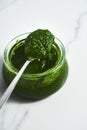 Pesto genovese or Pesto Verde. Italian sauce dip for pasta or other dishes. Green Pesto with basil and pine nuts and Royalty Free Stock Photo